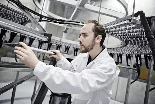 Rain Erossion testing in white lab coat