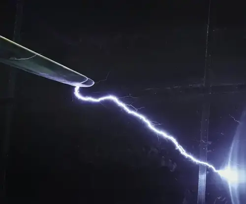 High‑voltage lightning arc striking a wind turbine